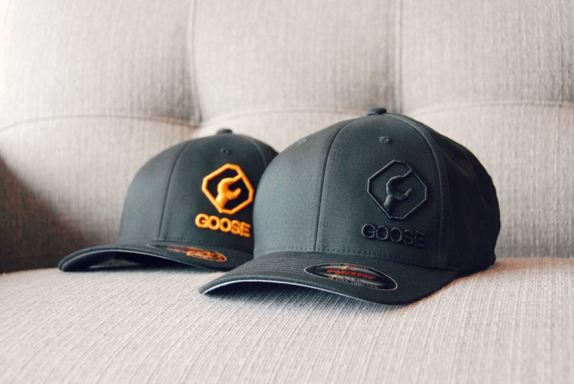 Two grey caps with logo
